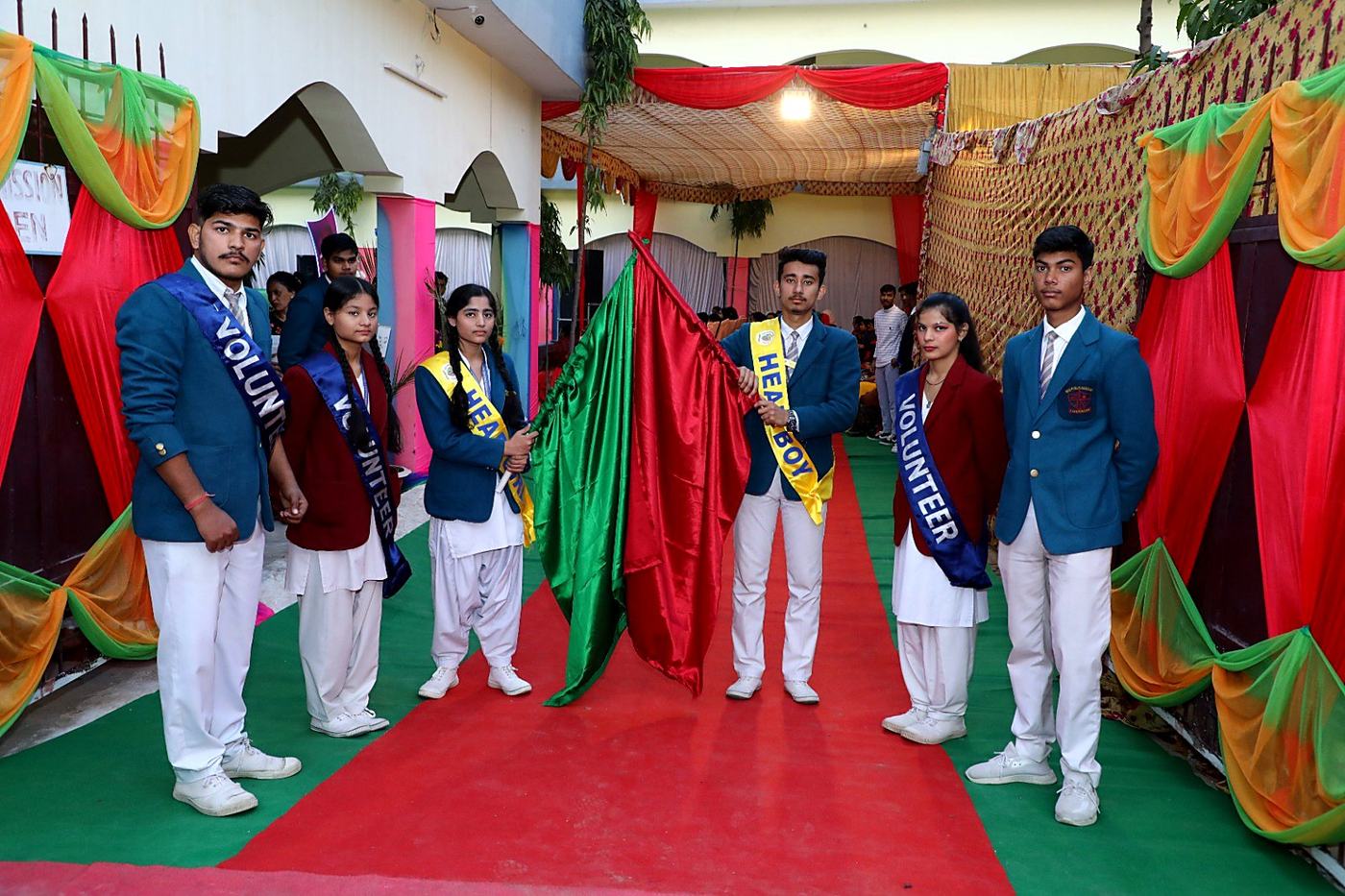 Student council members in blazers and sashes holding flags
